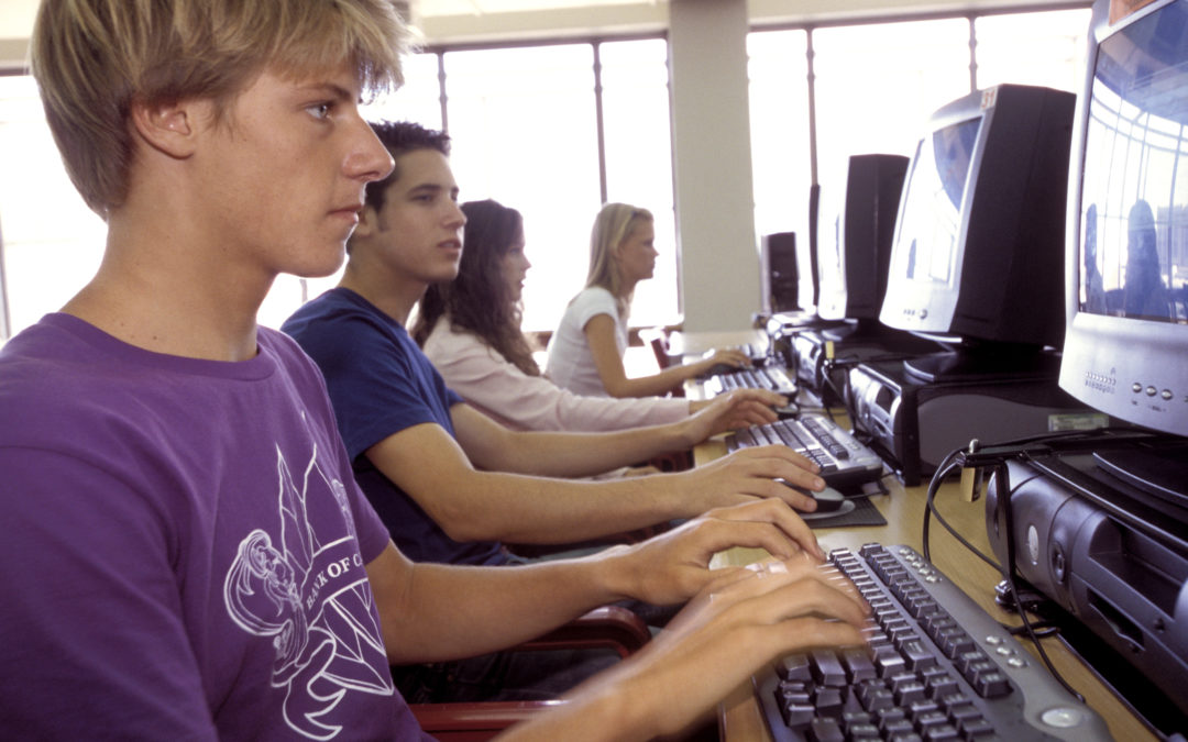 Students typing on computers