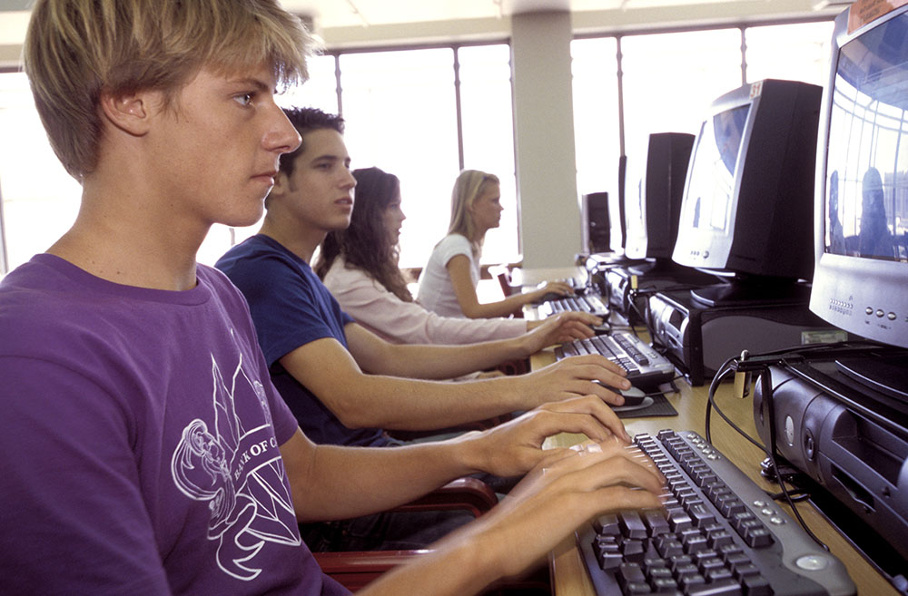 Students typing on computers